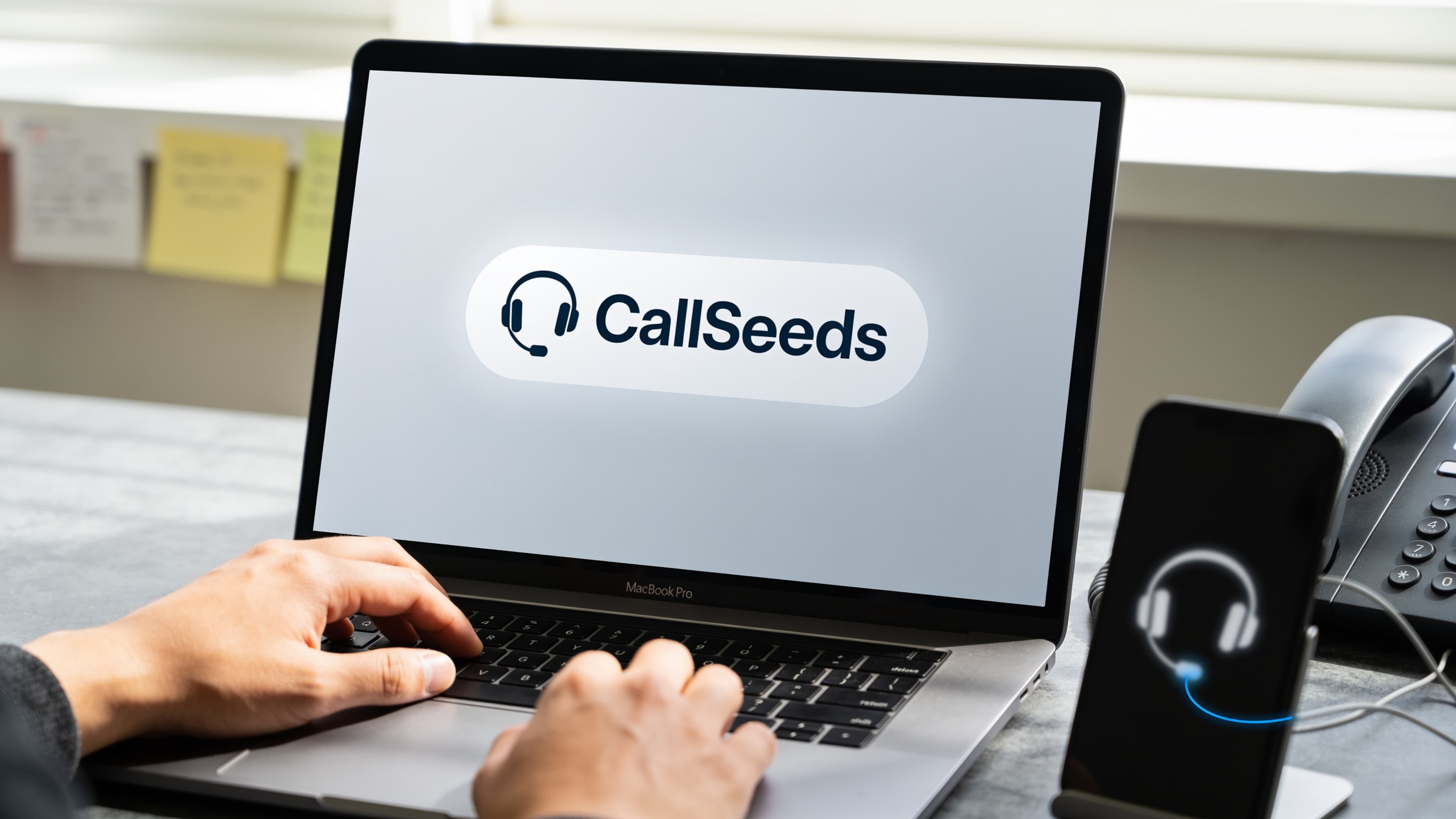 Business owner setting up a business phone line and compliance documents on a laptop