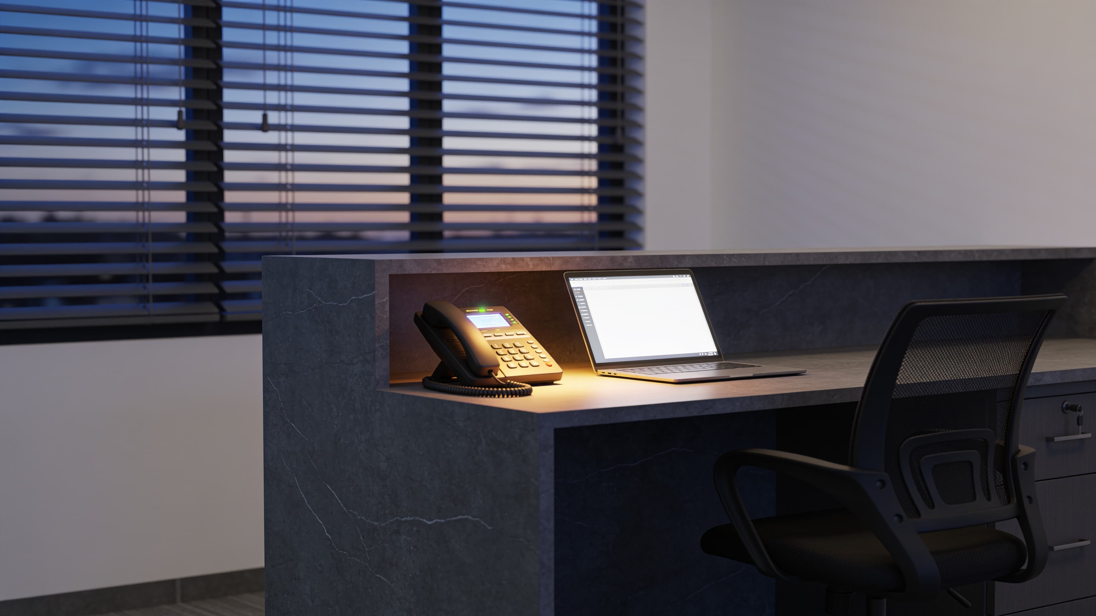 Clean front desk of a small modern office with a call being answered after hours